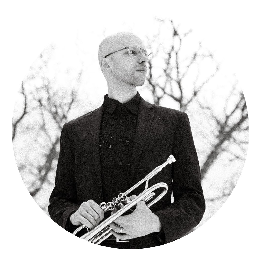 Jon A holding trumpet outdoors